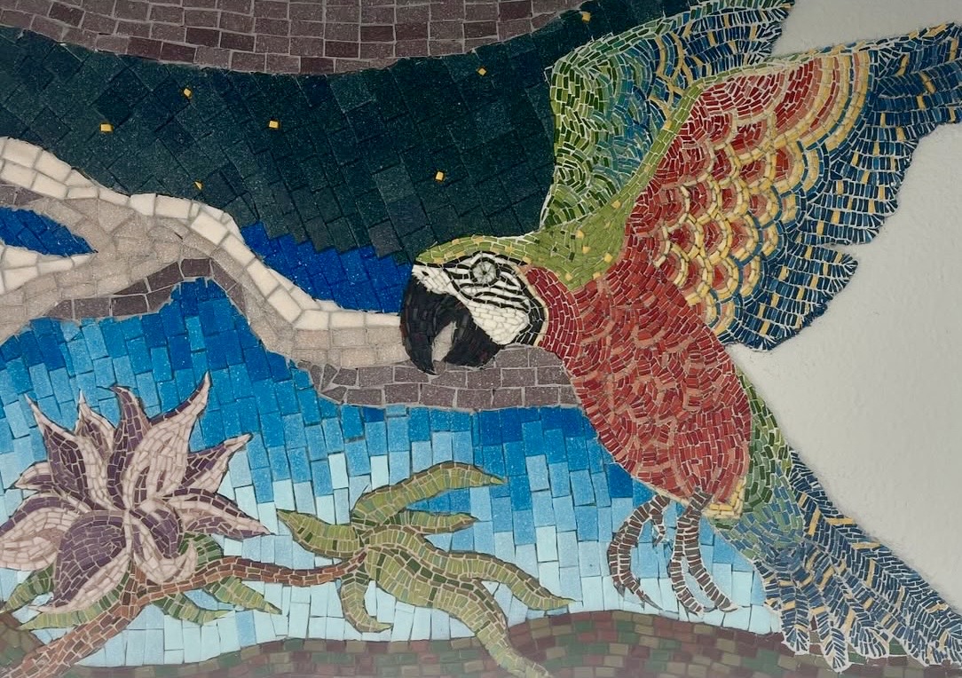 Detail of the red macaw in the Color of Evening mosaic, rendered in glass tesserae
